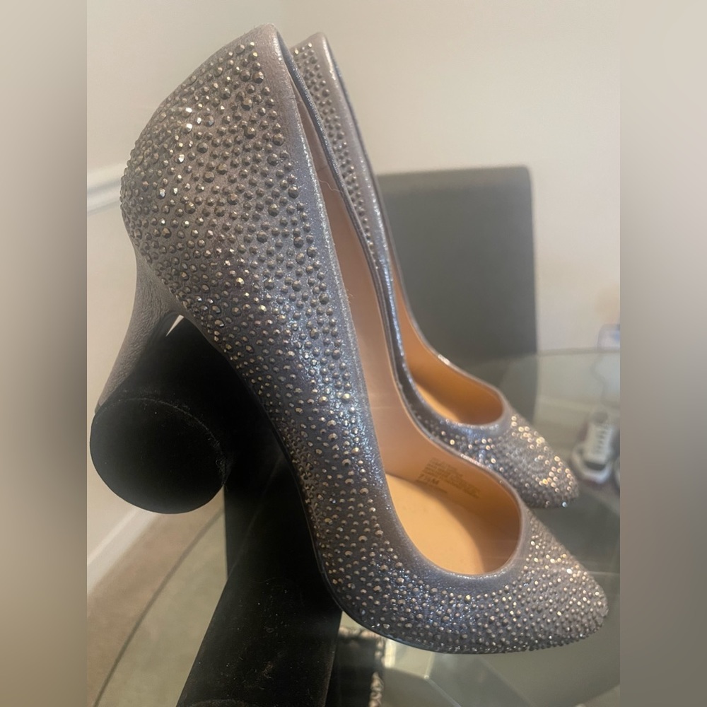 A brand new INC silver sequined closed high heel shoe